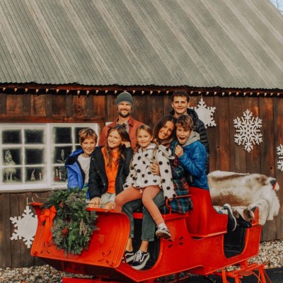 a person riding a horse in front of a building