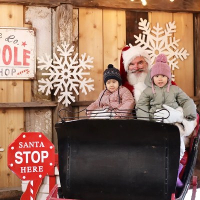 a group of people sitting at a stop sign