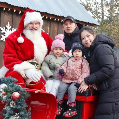 a group of people wearing costumes and standing in front of a building