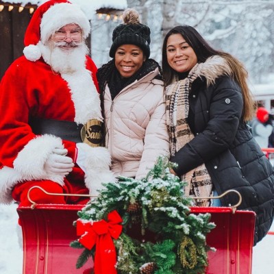 a couple of people that are standing in the snow