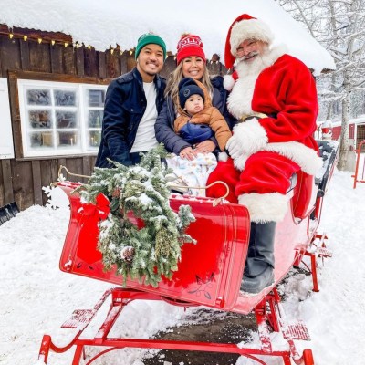 a group of people sitting in the snow