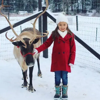 a person and a dog in the snow