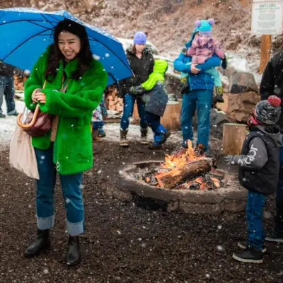 a group of people that are standing in the dirt