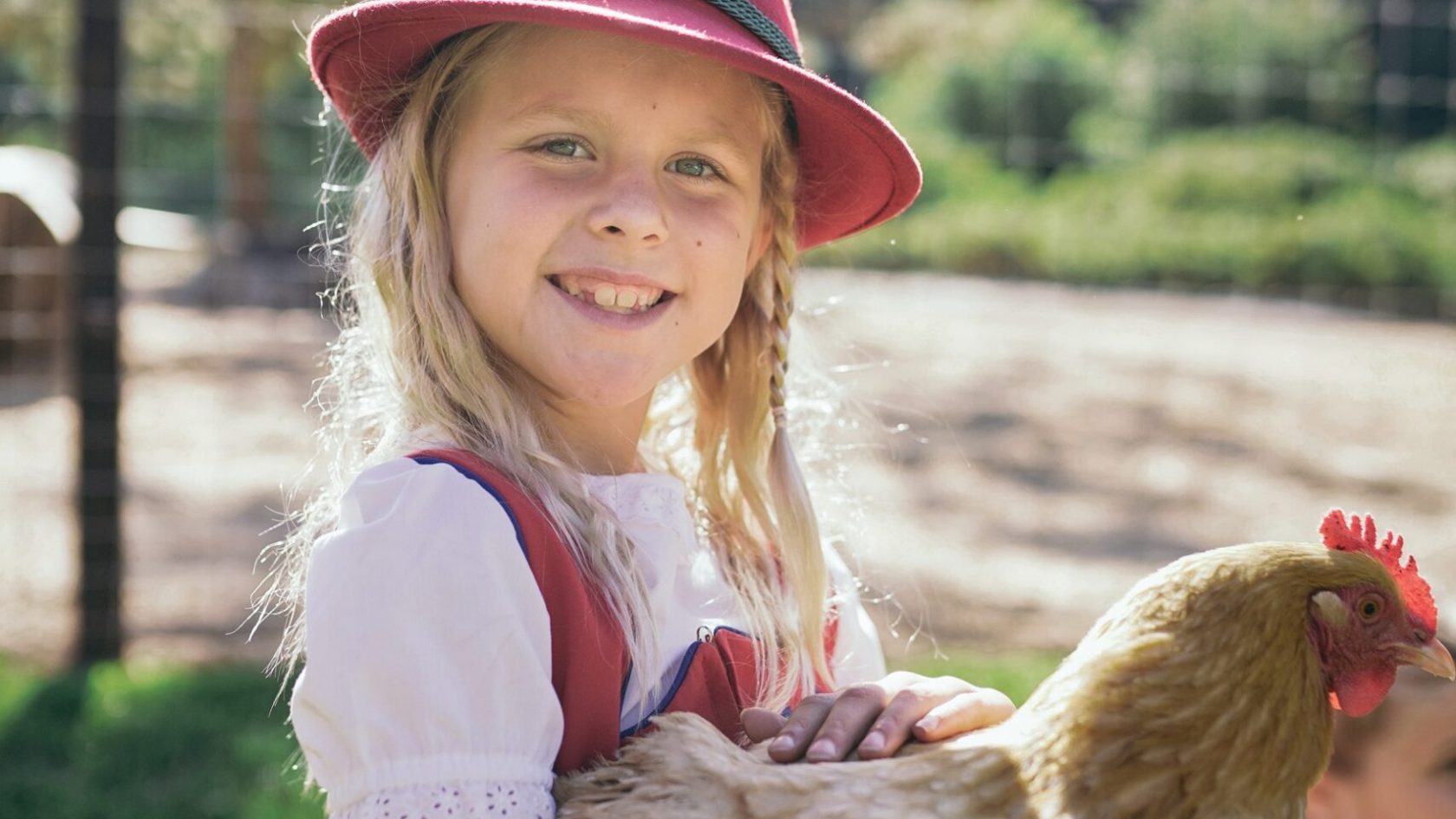 a little girl wearing a hat