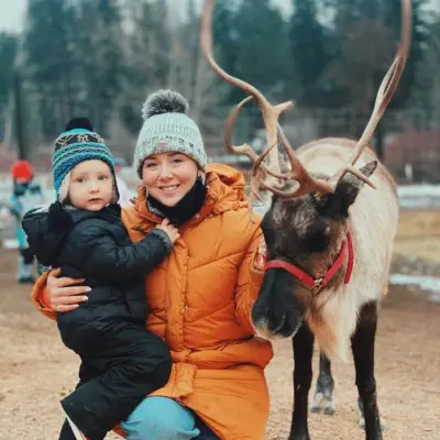 a person holding a deer