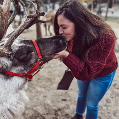 a woman holding a dog